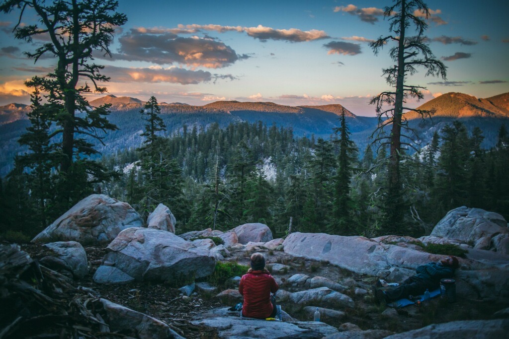 PCT thru-hiker looking at the view during sunset near South Lake Tahoe