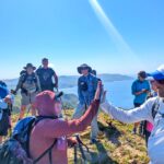 Thru-hikers helping each other and high-fiving!