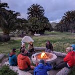 Thru-hikers meeting around a campfire