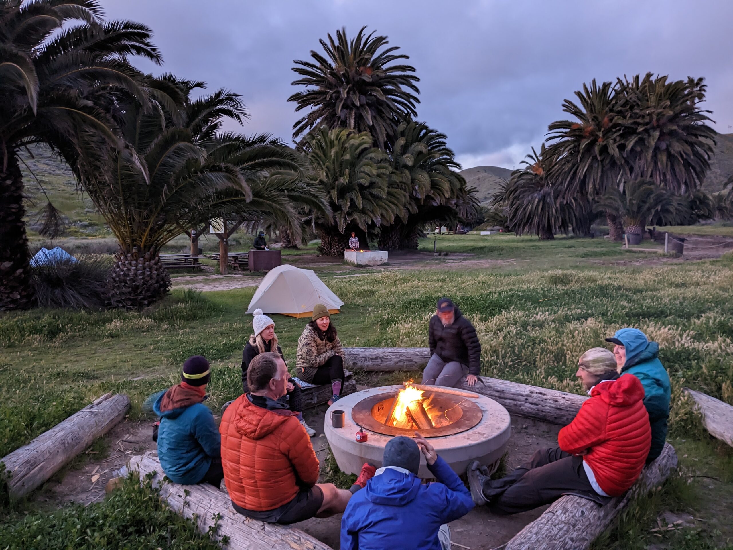 Thru-hikers meeting around a campfire